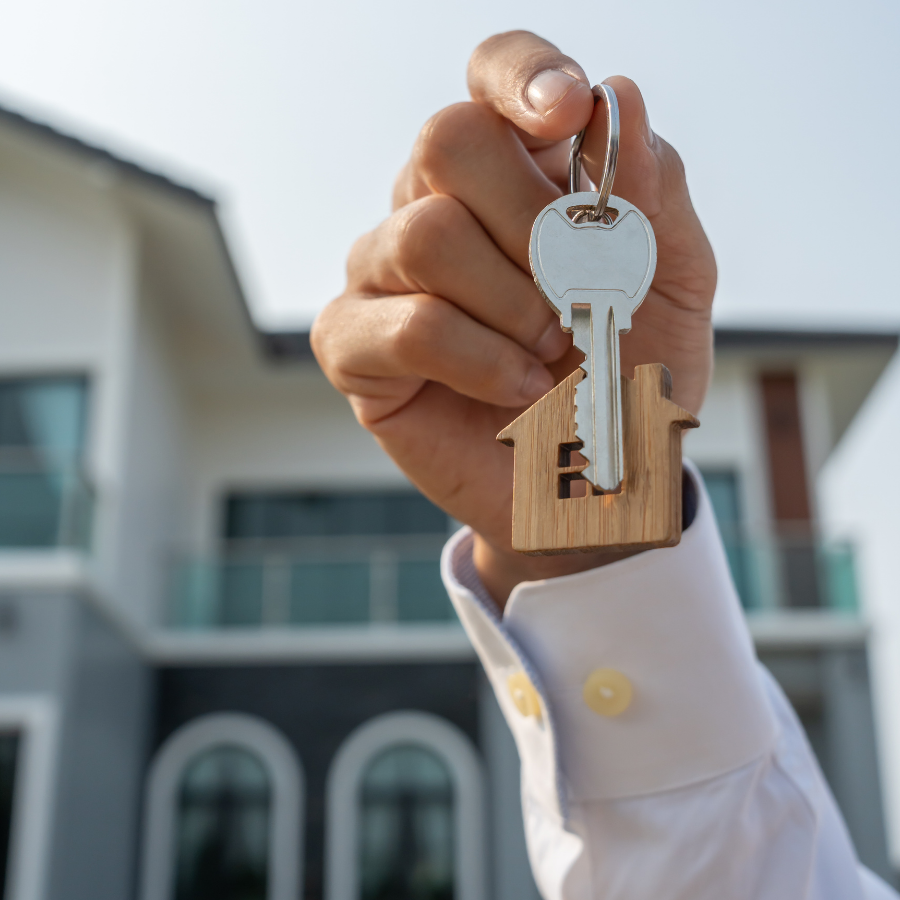electrical-system-home-inspection - Arkansas Home Tech Inspections Wooden toy house under a magnifying glass, symbolizing searching for a home